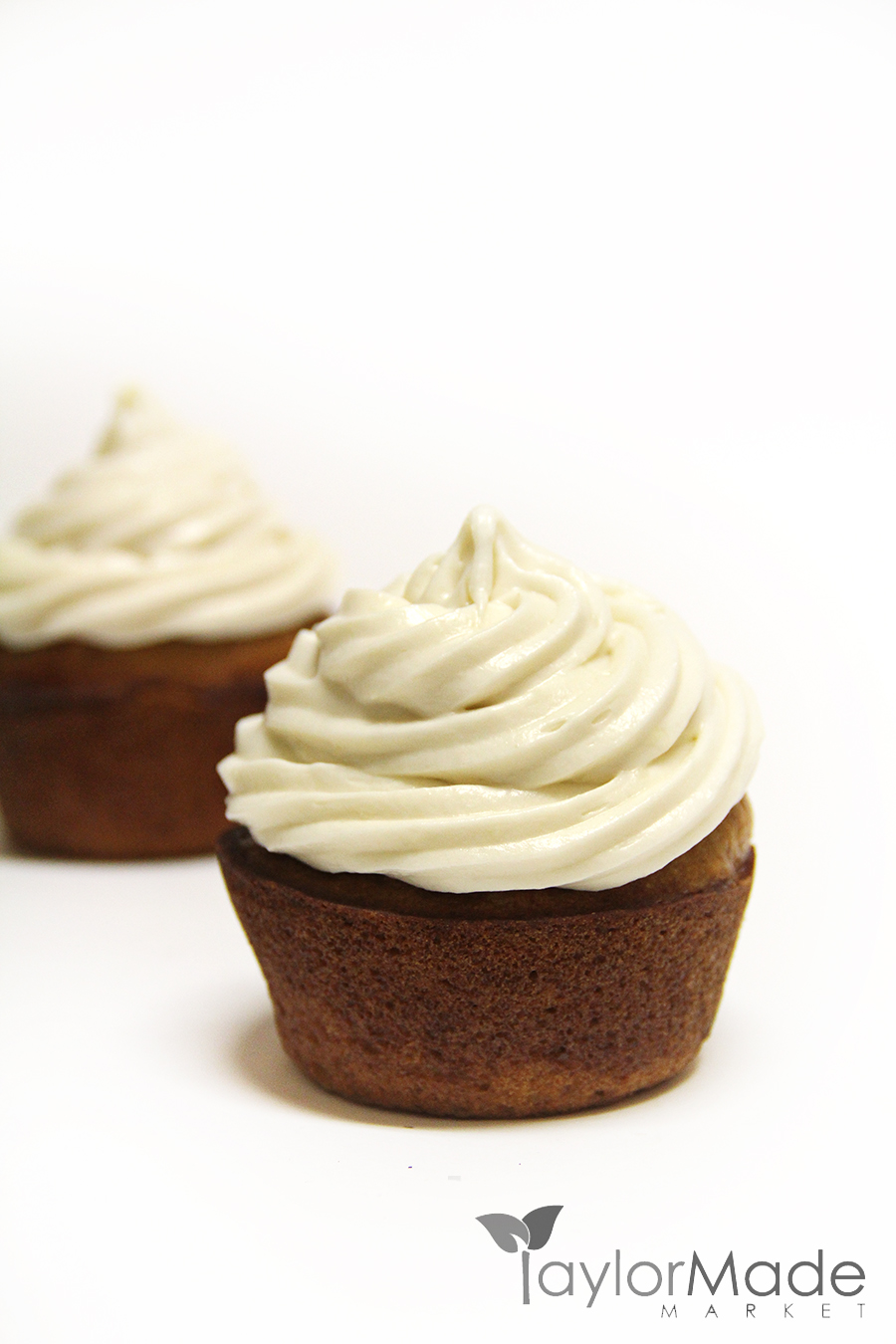 cupcake frosted on white vertical